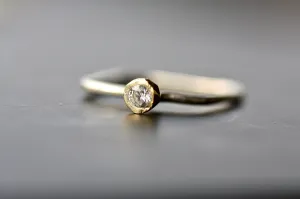 Dainty gold K18 engagement ring