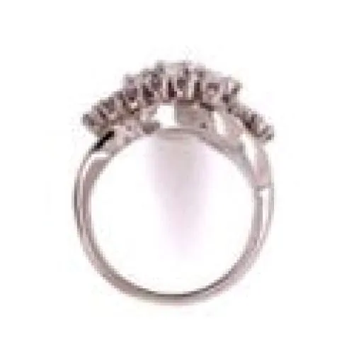 Platinum 1950's 3 stone Cluster Round Brilliant Diamond Ring at Regard Jewelry in Austin, Texas